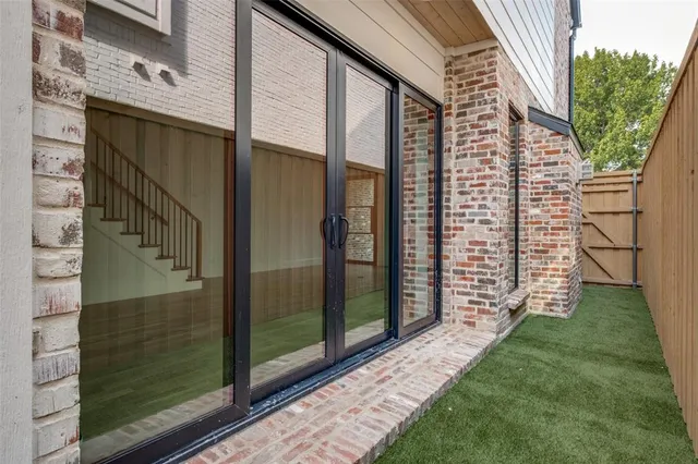 a view of a back yard from a balcony