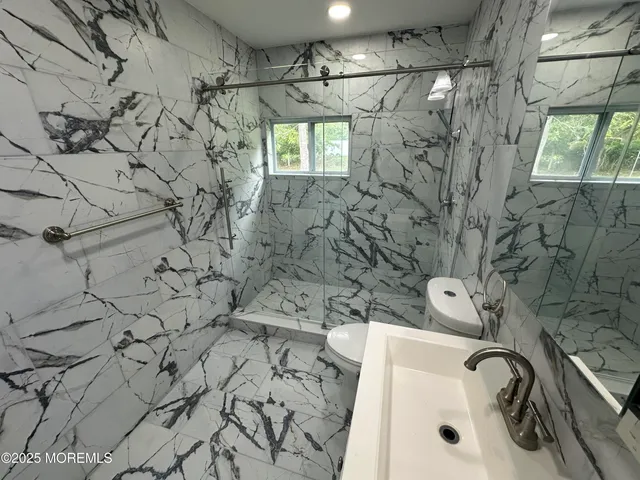 a bathroom with a bathtub and shower