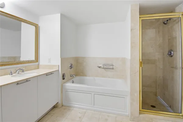 a bathroom with a bathtub and a sink