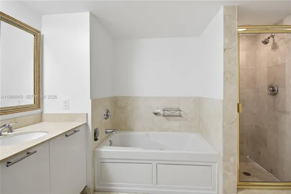 a bathroom with a bathtub and a sink