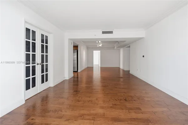 a view of an empty room with shelves