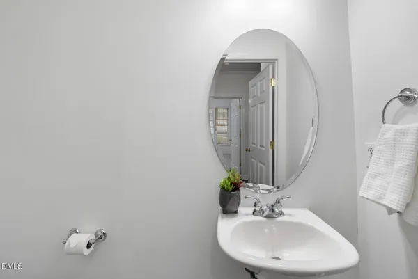 a bathroom with a granite countertop toilet a sink and shower