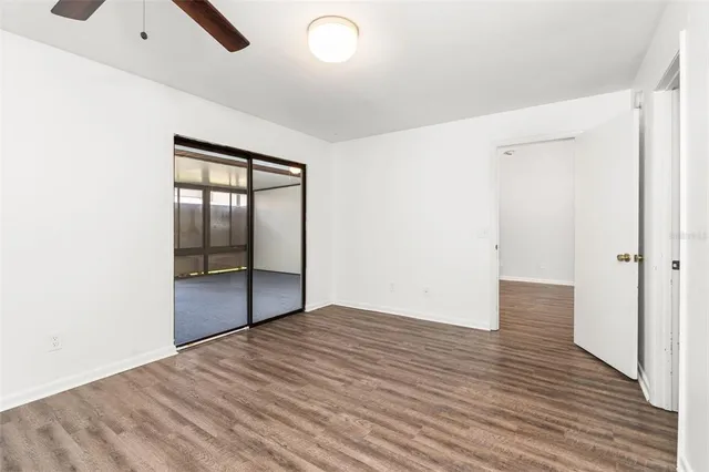 a view of a room with wooden floor