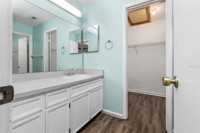 a white toilet and tub sitting next to a bathroom sink