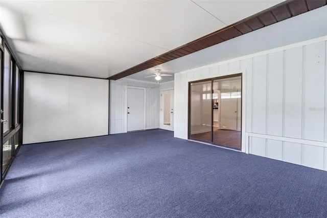 a view of empty room with floor to ceiling window