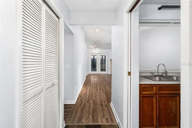a kitchen with stainless steel appliances a sink stove and cabinets