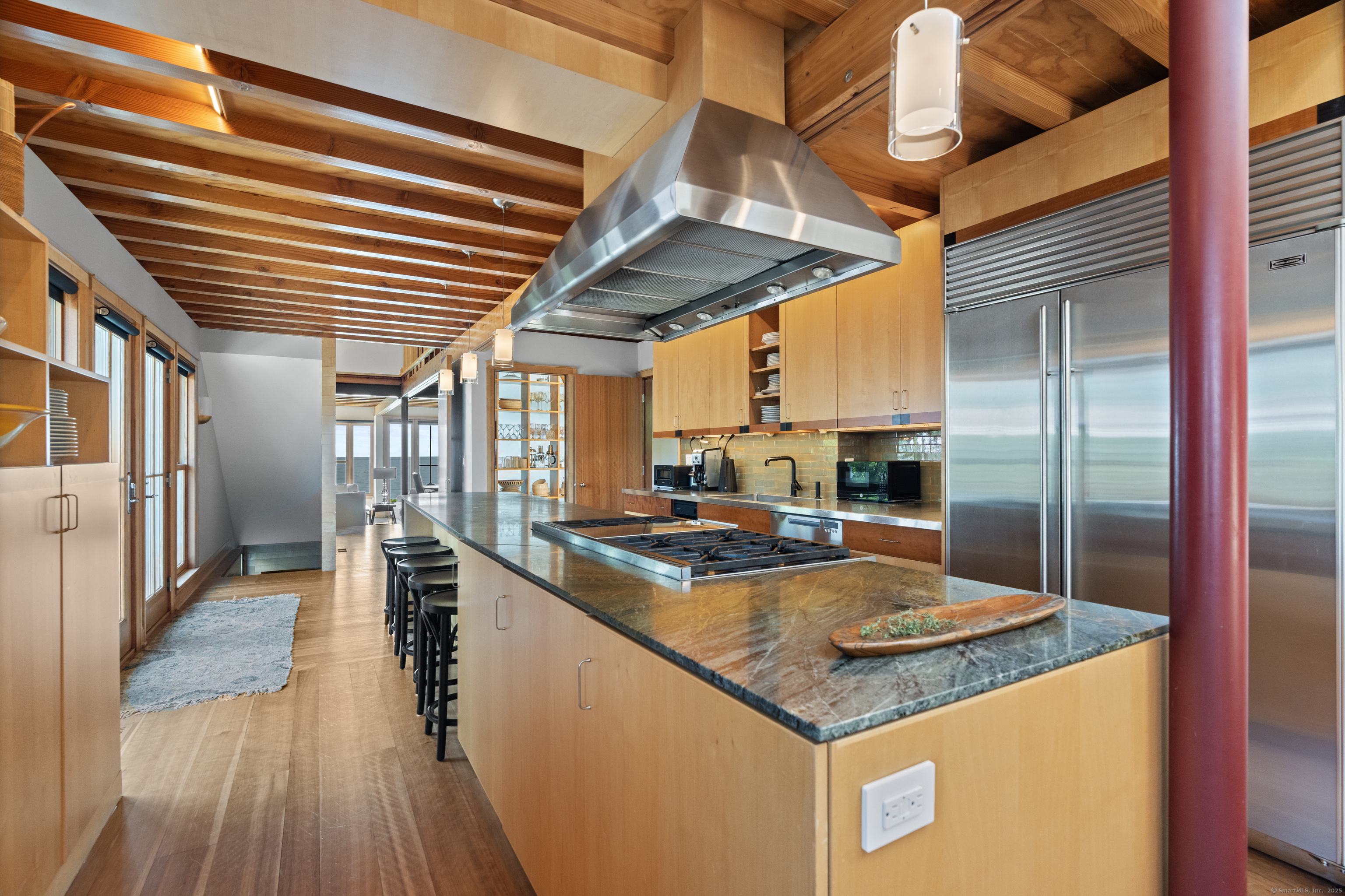 33 Seaview Avenue Madison, CT 06443 - Photo 12 of 40 a kitchen with stainless steel appliances granite countertop a sink a stove and a refrigerator