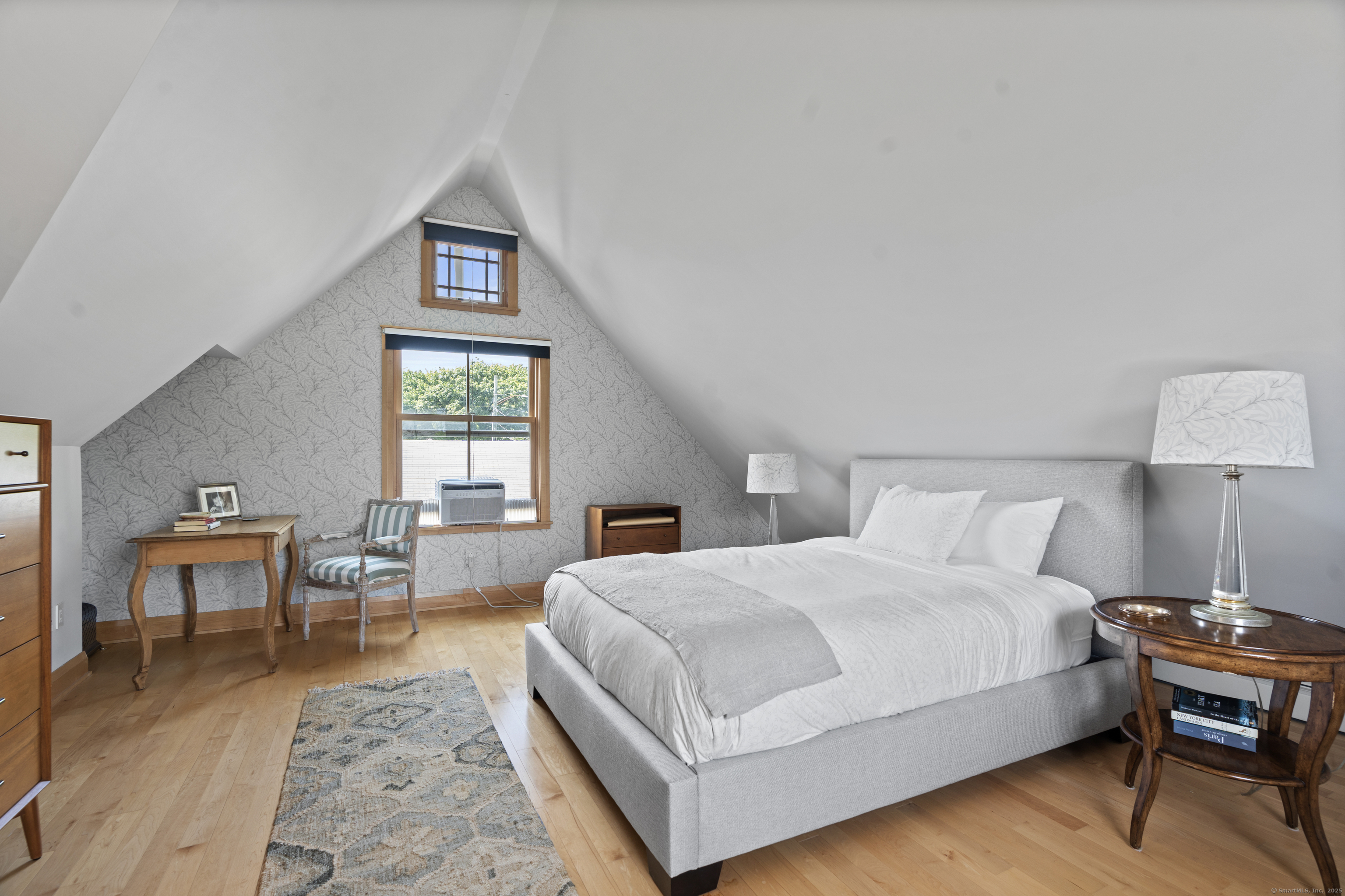 33 Seaview Avenue Madison, CT 06443 - Photo 15 of 40 a living room with a bed furniture and a window
