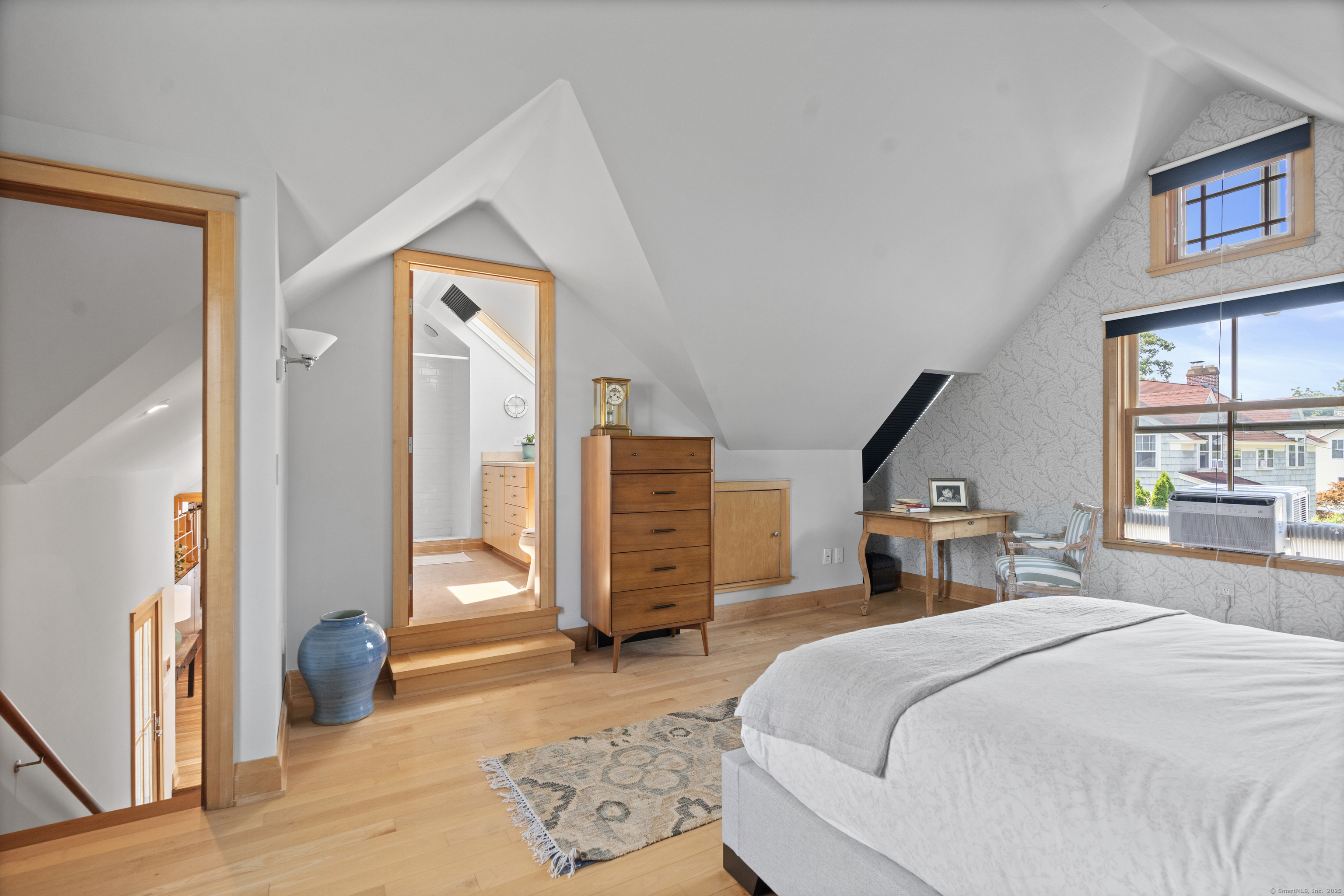 33 Seaview Avenue Madison, CT 06443 - Photo 16 of 40 a bedroom with a bed a dresser and a large window