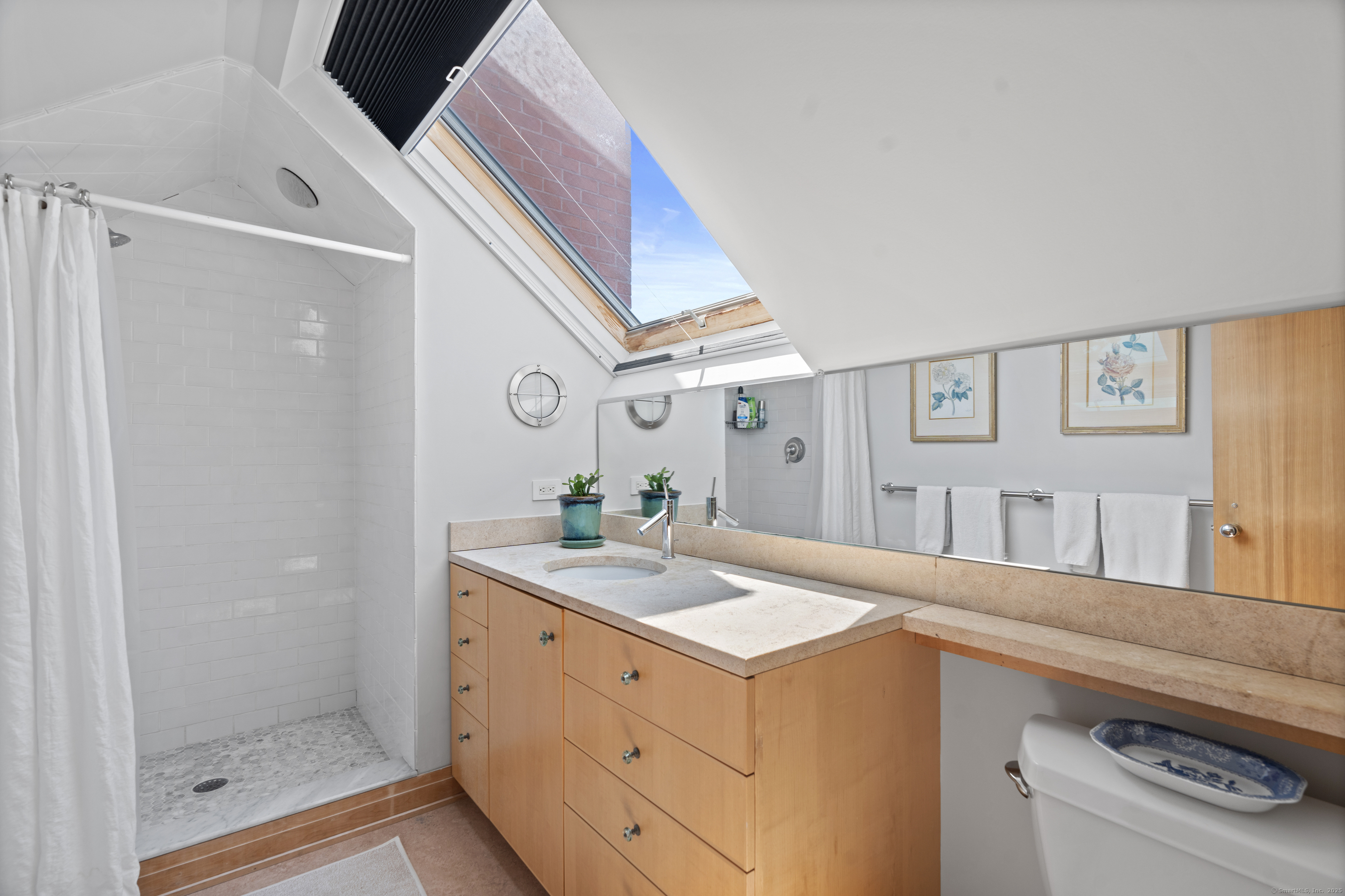 33 Seaview Avenue Madison, CT 06443 - Photo 17 of 40 a bathroom with a sink and a mirror