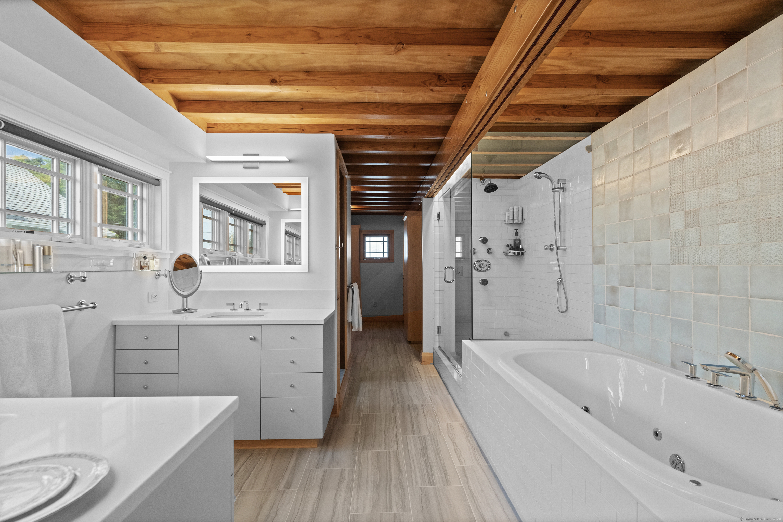 33 Seaview Avenue Madison, CT 06443 - Photo 24 of 40 a spacious bathroom with a bathtub and a sink