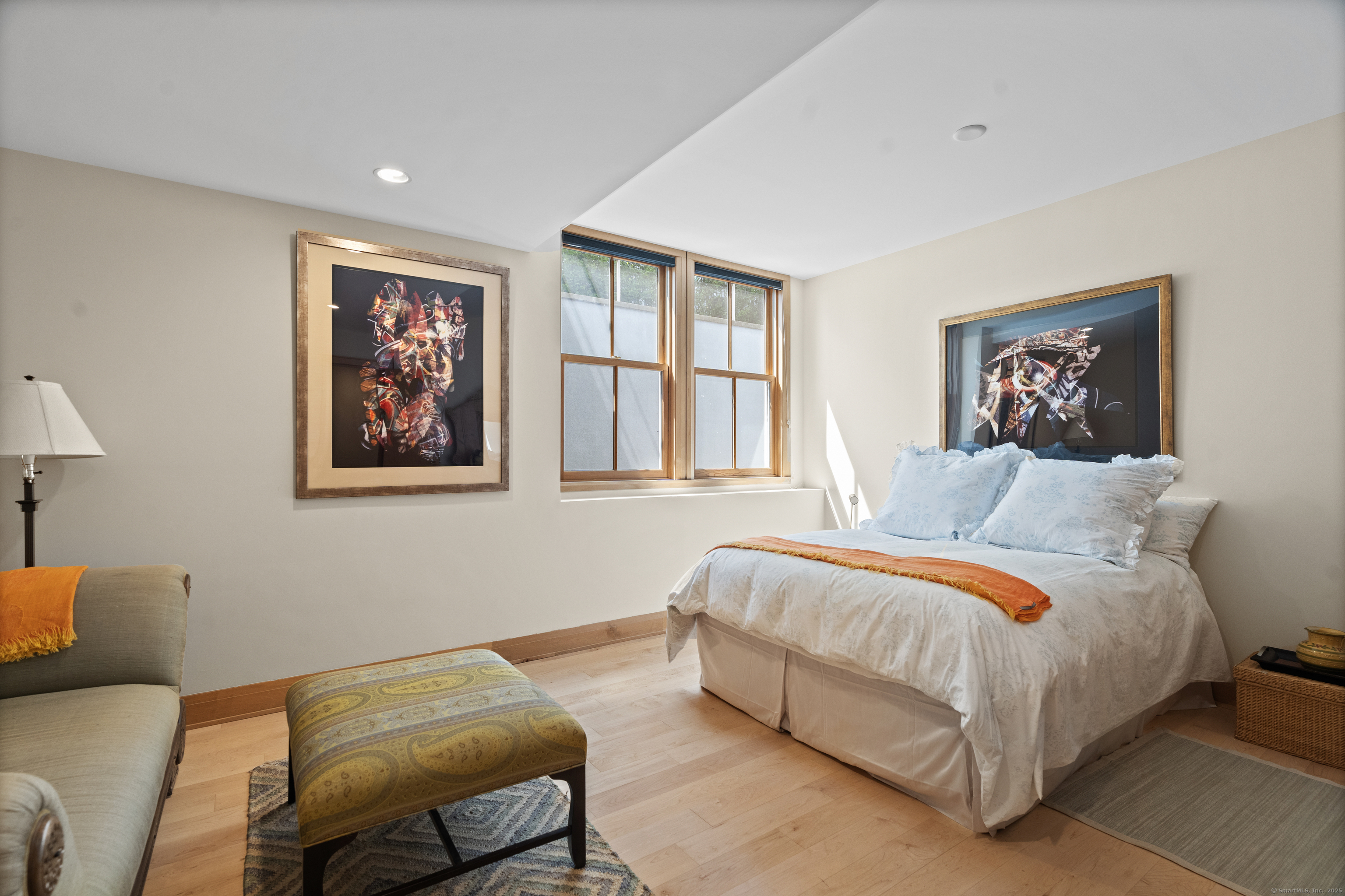 33 Seaview Avenue Madison, CT 06443 - Photo 36 of 40 a bedroom with a bed and a couch