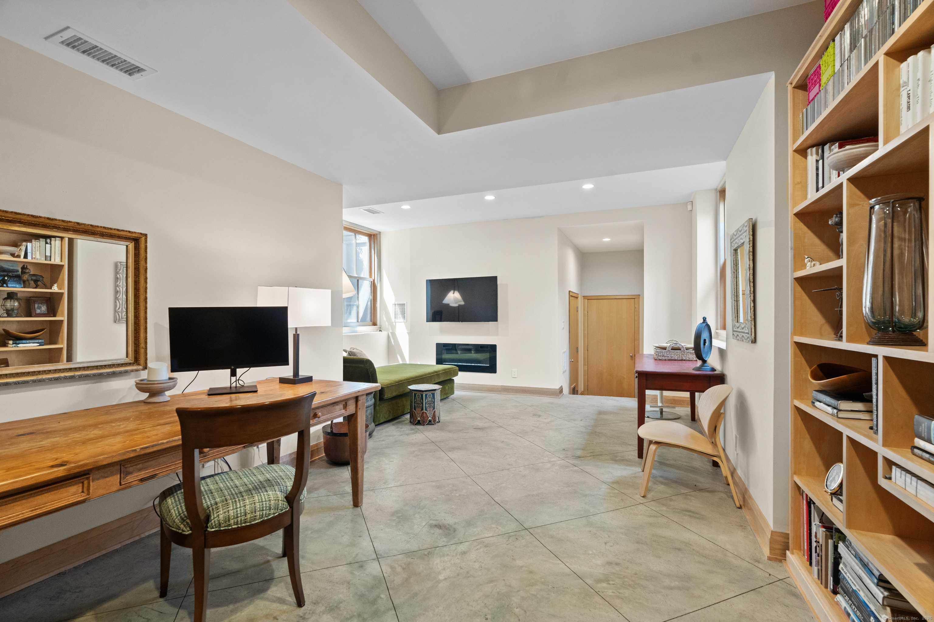 33 Seaview Avenue Madison, CT 06443 - Photo 39 of 40 a view of a workspace with furniture and a potted plant