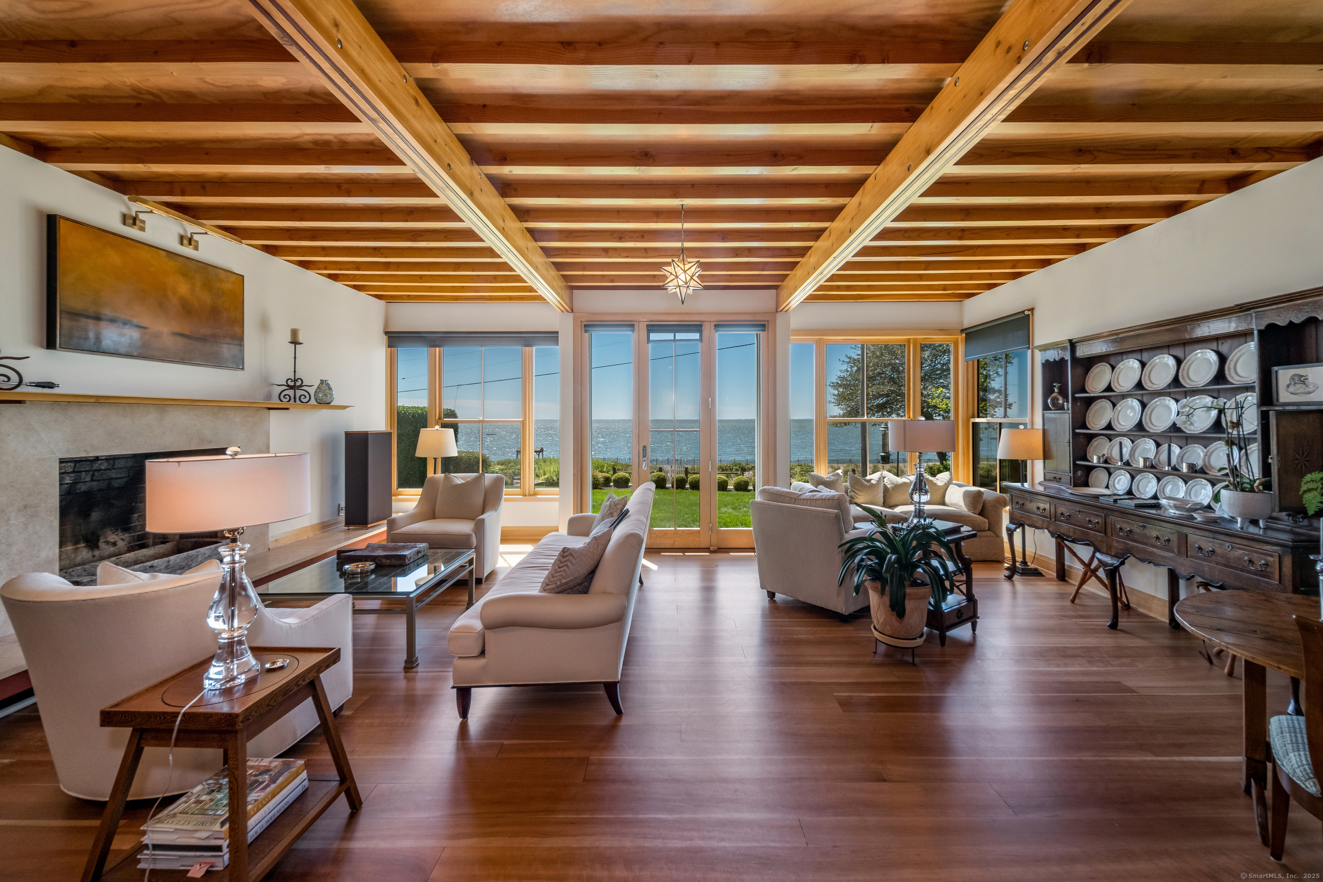 33 Seaview Avenue Madison, CT 06443 - Photo 4 of 40 a living room with fireplace furniture and a wooden floor