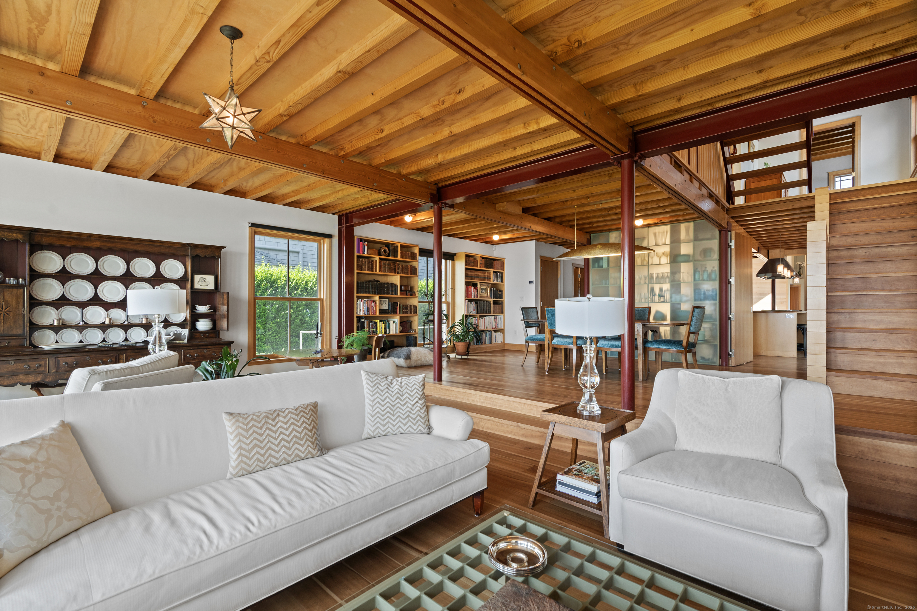 33 Seaview Avenue Madison, CT 06443 - Photo 7 of 40 a living room with furniture and a chandelier