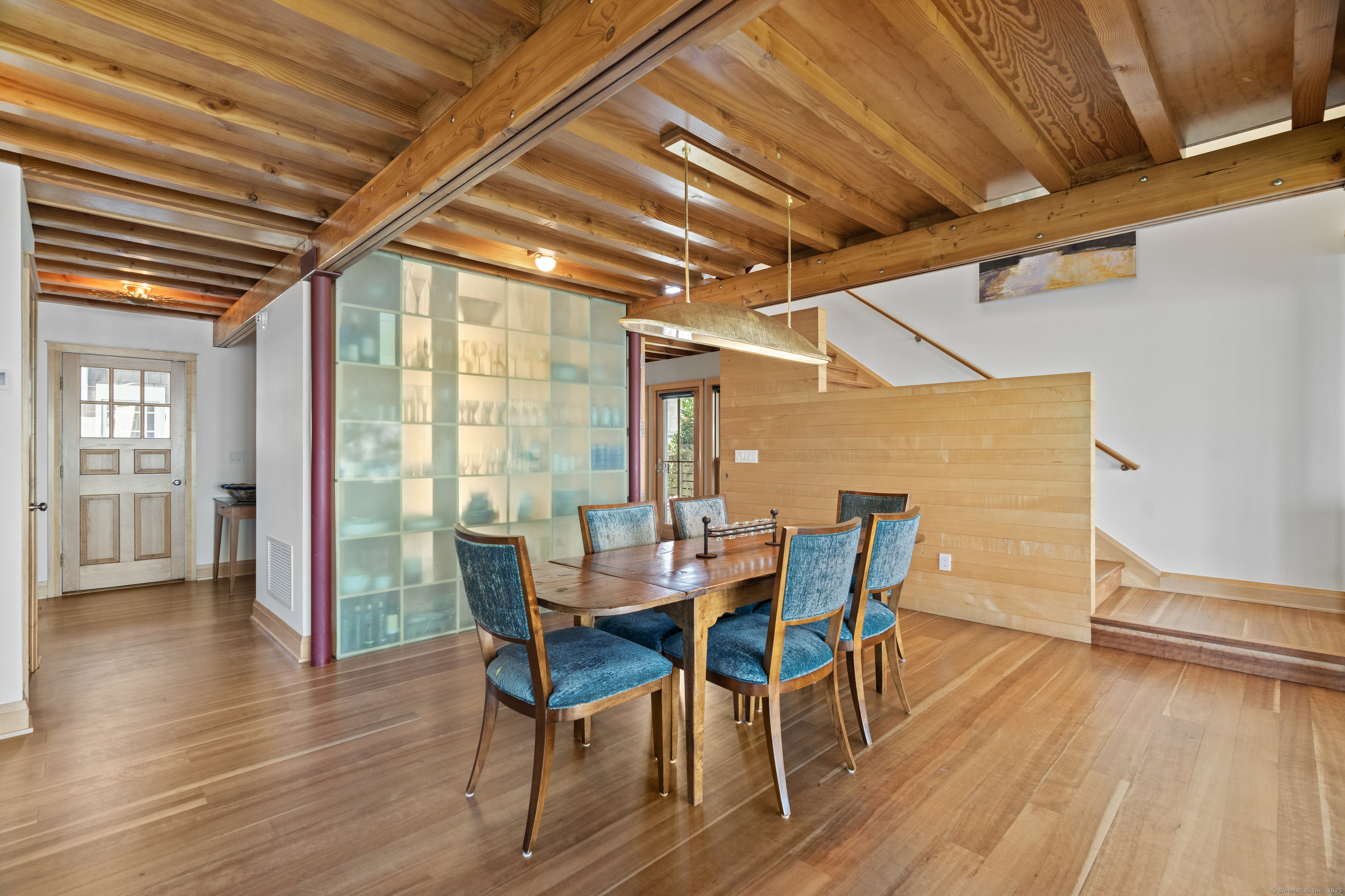 33 Seaview Avenue Madison, CT 06443 - Photo 8 of 40 a dining room with furniture wooden floor and a rug