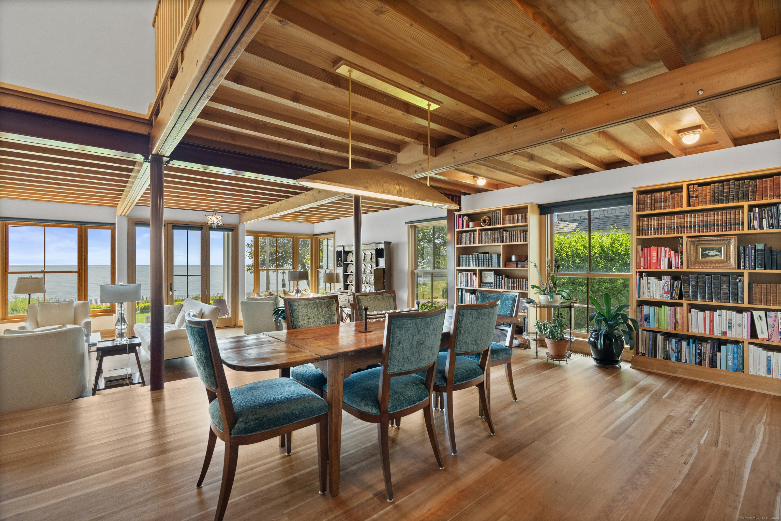 33 Seaview Avenue Madison, CT 06443 - Photo 10 of 40 a dining room with furniture window and wooden floor