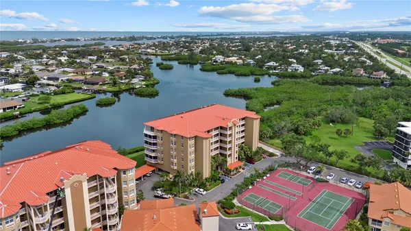 an aerial view of a house with a lake view