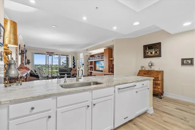 a kitchen with sink and cabinets