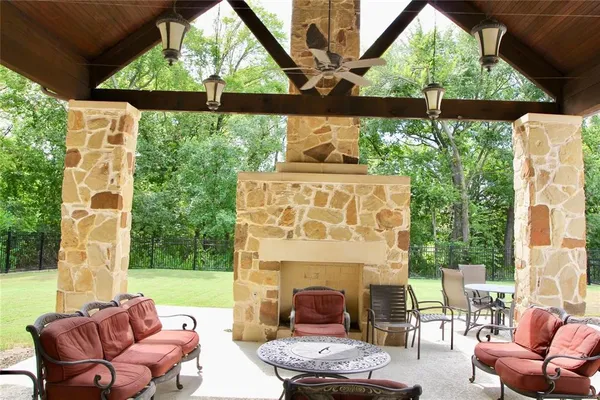 a building outdoor space with patio furniture and potted plants