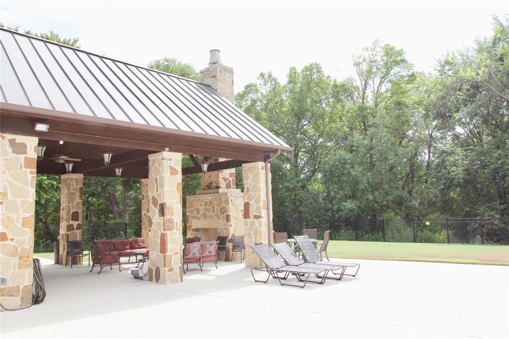 4821 Bayview Drive Plano, TX 75093 - Photo 20 of 21 a backyard of a house with table and chairs