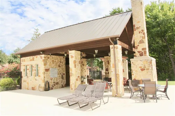 a view of pool with patio