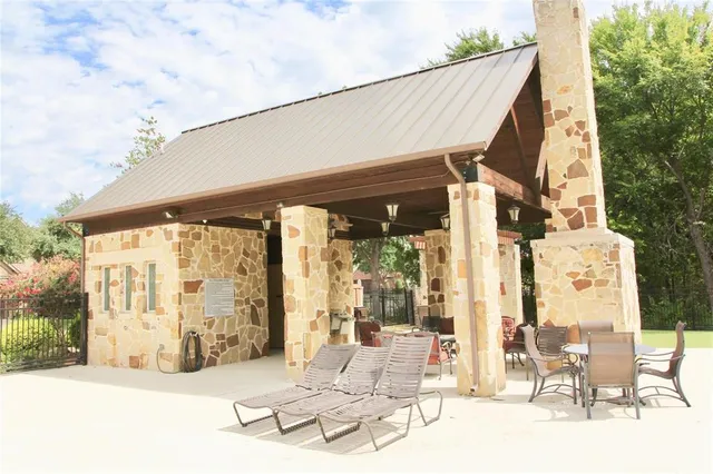 a view of pool with patio