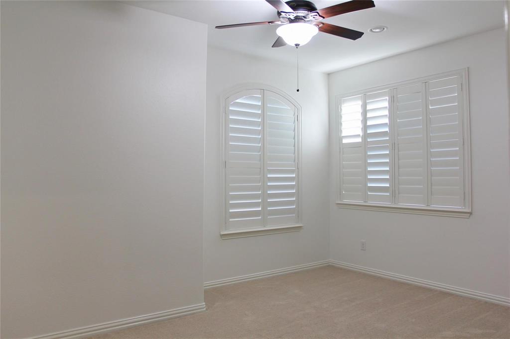 4821 Bayview Drive Plano, TX 75093 - Photo 8 of 21 an empty room with windows and fan