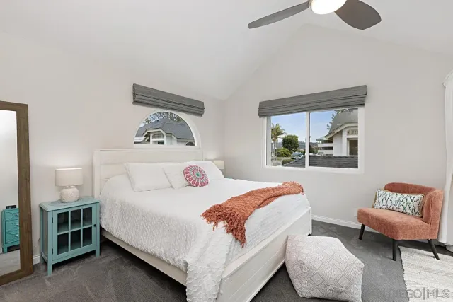 a bedroom with a bed and a couch