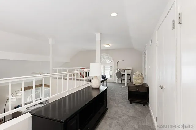 a view of living room with furniture and windows