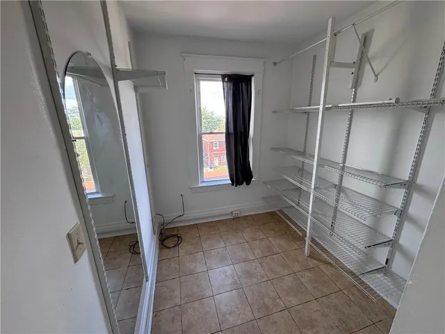 a view of an empty walk in closet