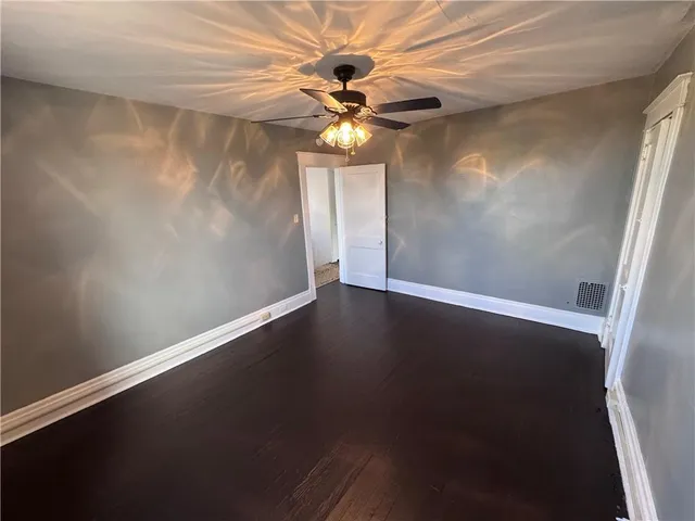 a view of wooden floor in an empty room