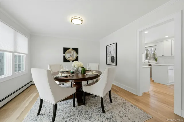 a view of a room that has a table and chairs in it