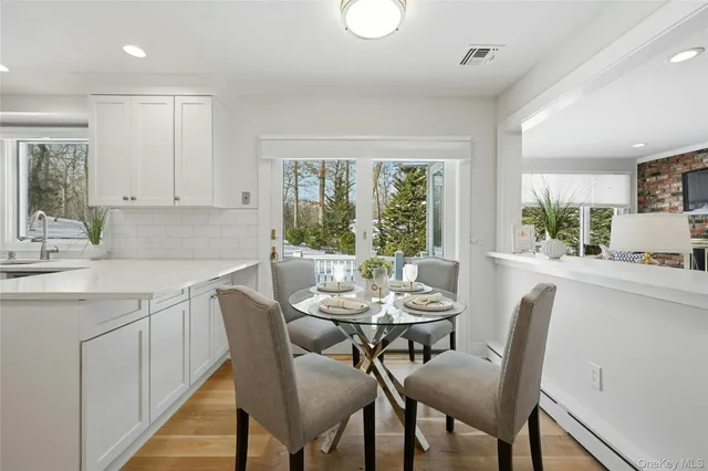 a dining room with furniture and window