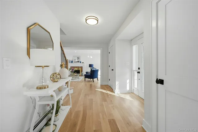 a view of a kitchen with wooden floor