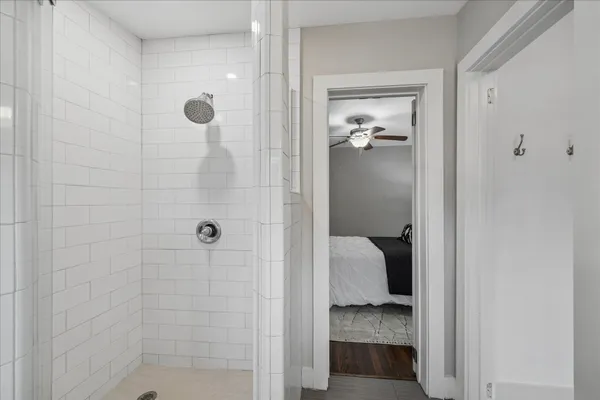 a bathroom with a walk in shower and a bathroom