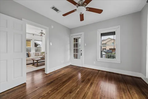 wooden floor in an empty room with a window
