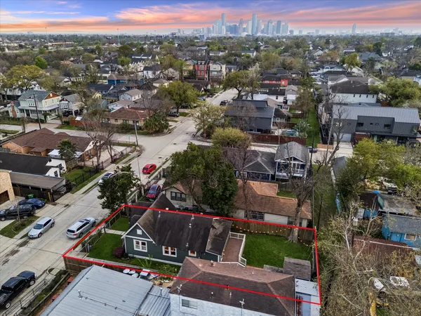 an aerial view of residential houses with outdoor space