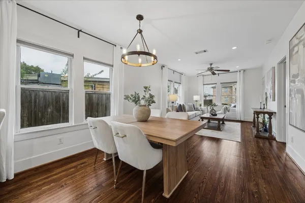a view of a dining room with furniture window and wooden floor