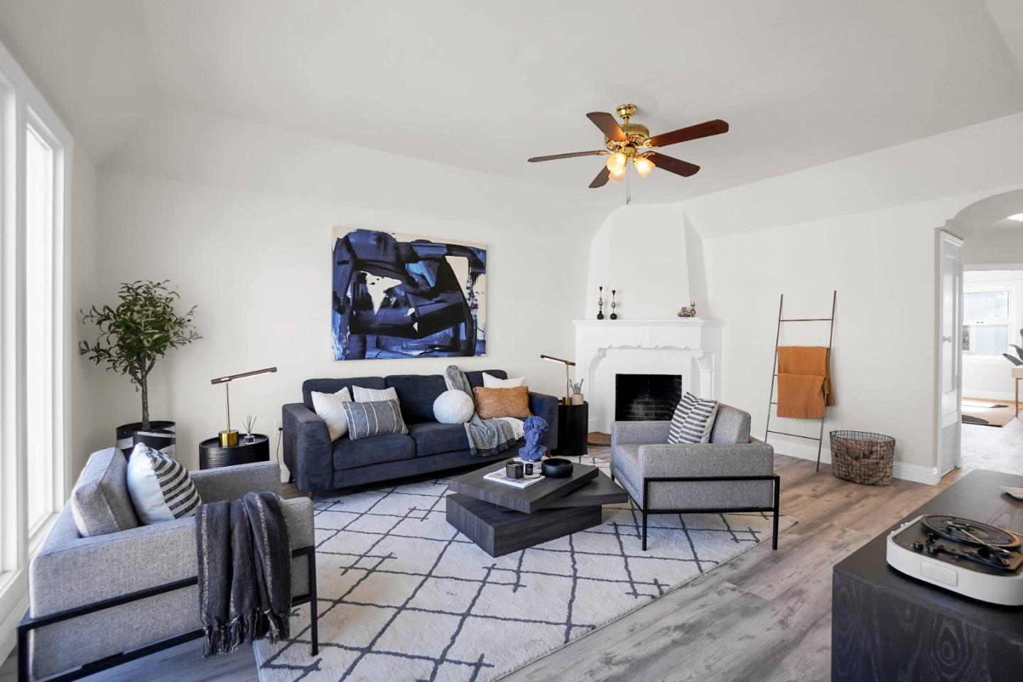 245 Talbert Street San Francisco, CA 94134 - Photo 1 of 71 a living room with furniture a fireplace and a chandelier