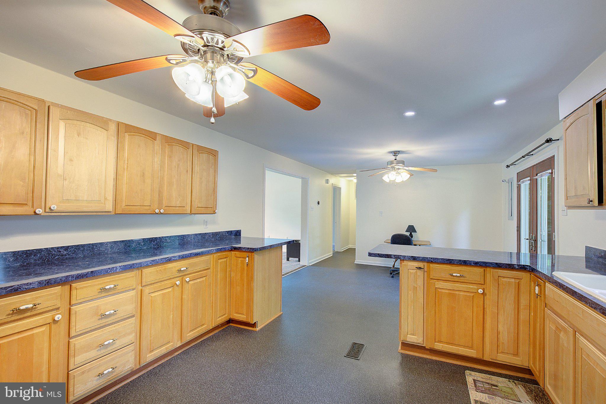 1111 Redeye Road Lusby, MD 20657 - Photo 2 of 24 Spacious kitchen with warm wood tones.