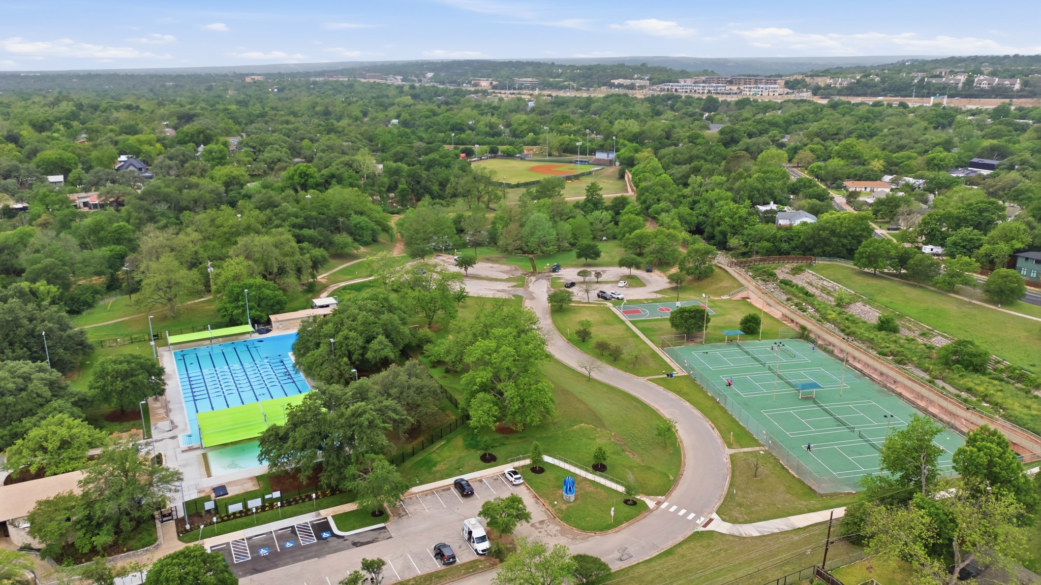 6444 Burnet Road, Unit 403 Austin, TX 78757 - Photo 25 of 29 an aerial view of a house with outdoor space and a lake view