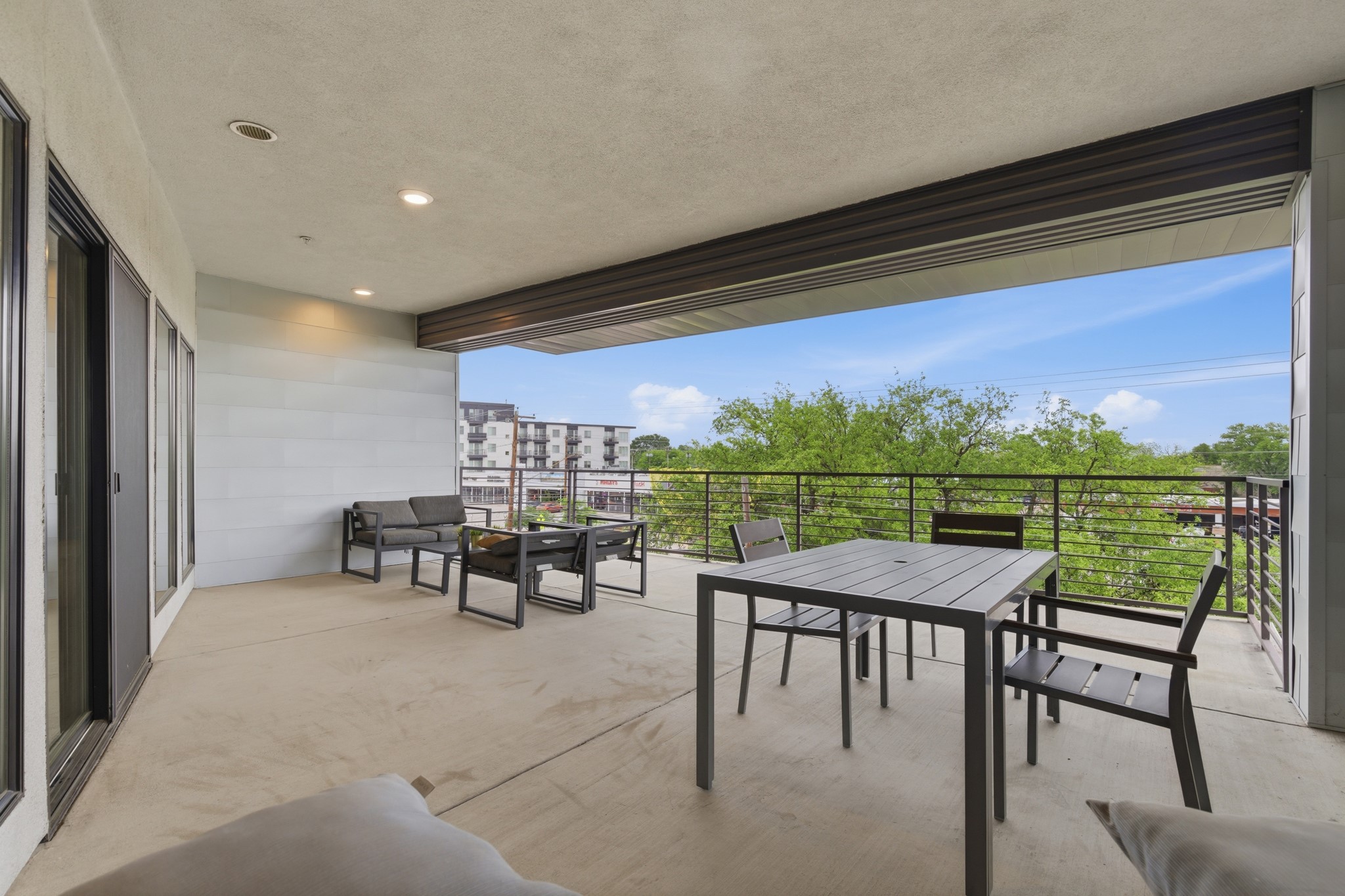 6444 Burnet Road, Unit 403 Austin, TX 78757 - Photo 29 of 29 a view of a chairs and table in patio