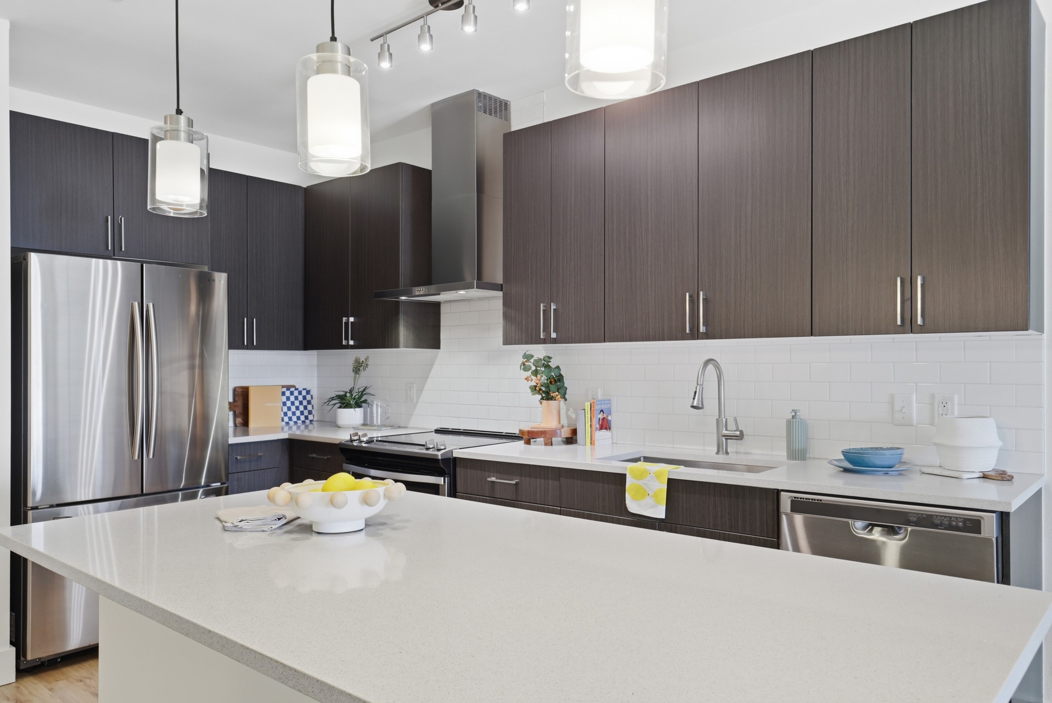 6444 Burnet Road, Unit 403 Austin, TX 78757 - Photo 6 of 29 a kitchen with refrigerator and cabinets