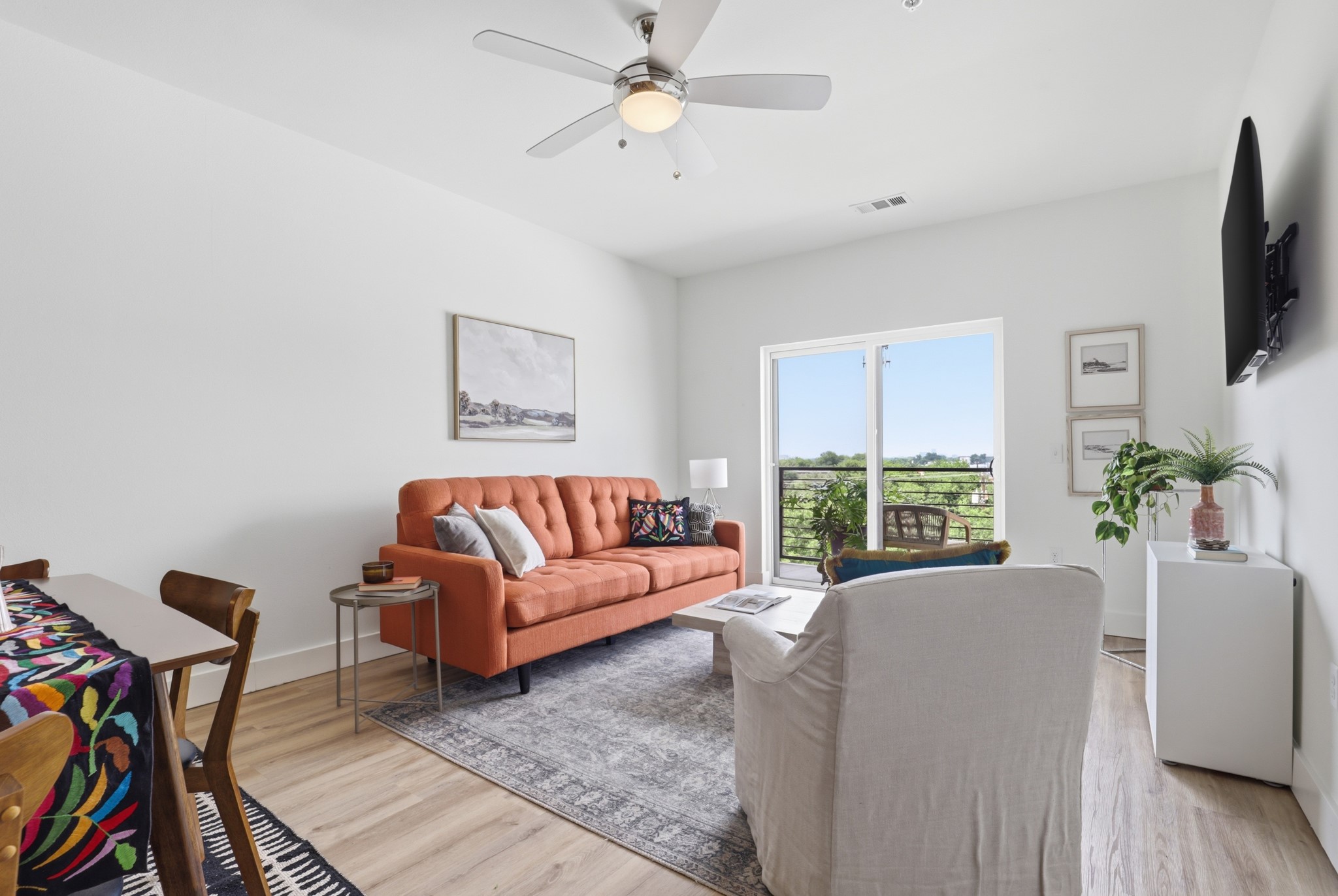 6444 Burnet Road, Unit 403 Austin, TX 78757 - Photo 7 of 29 a living room with furniture fireplace and a flat screen tv