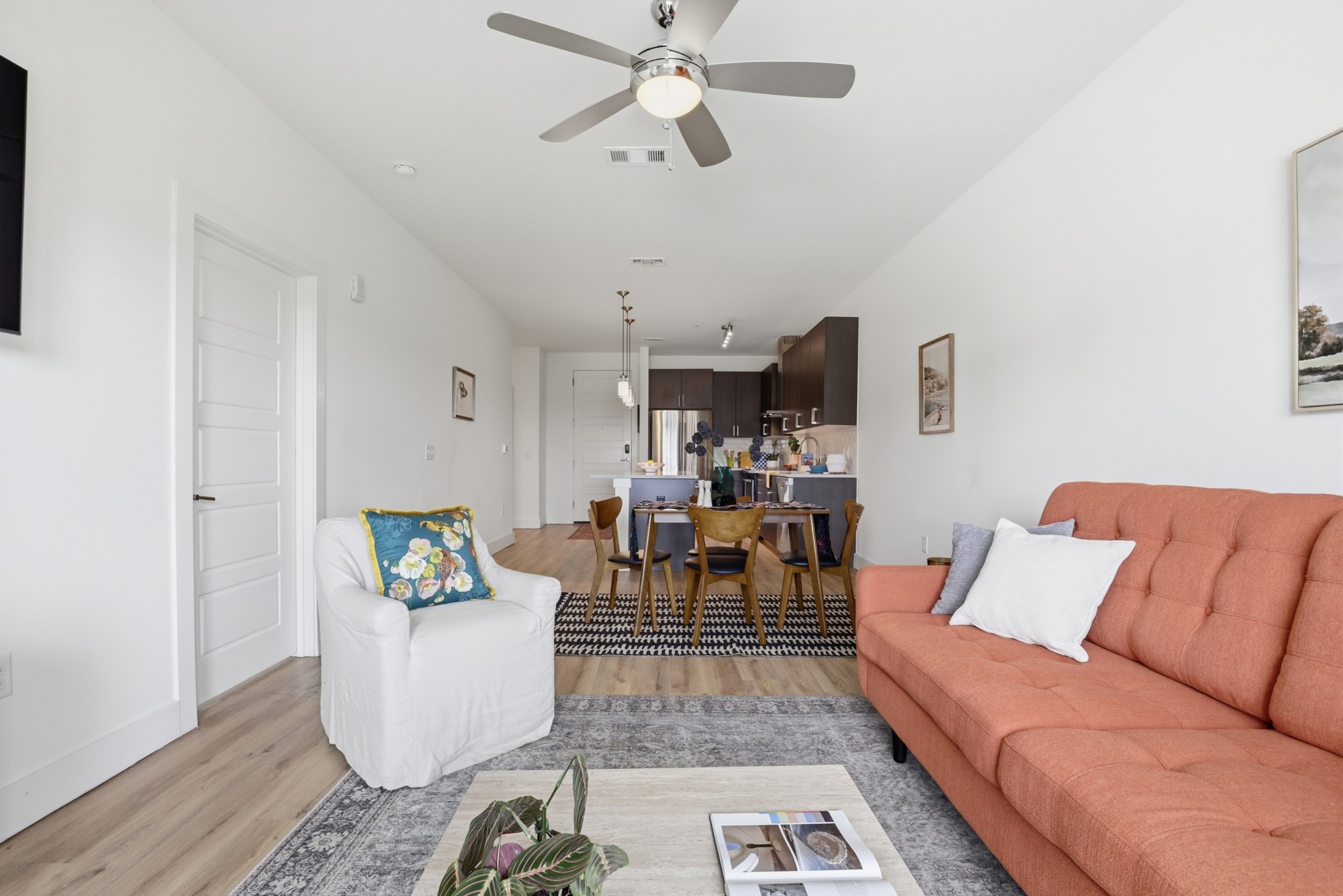 6444 Burnet Road, Unit 403 Austin, TX 78757 - Photo 9 of 29 a living room with furniture and a chandelier