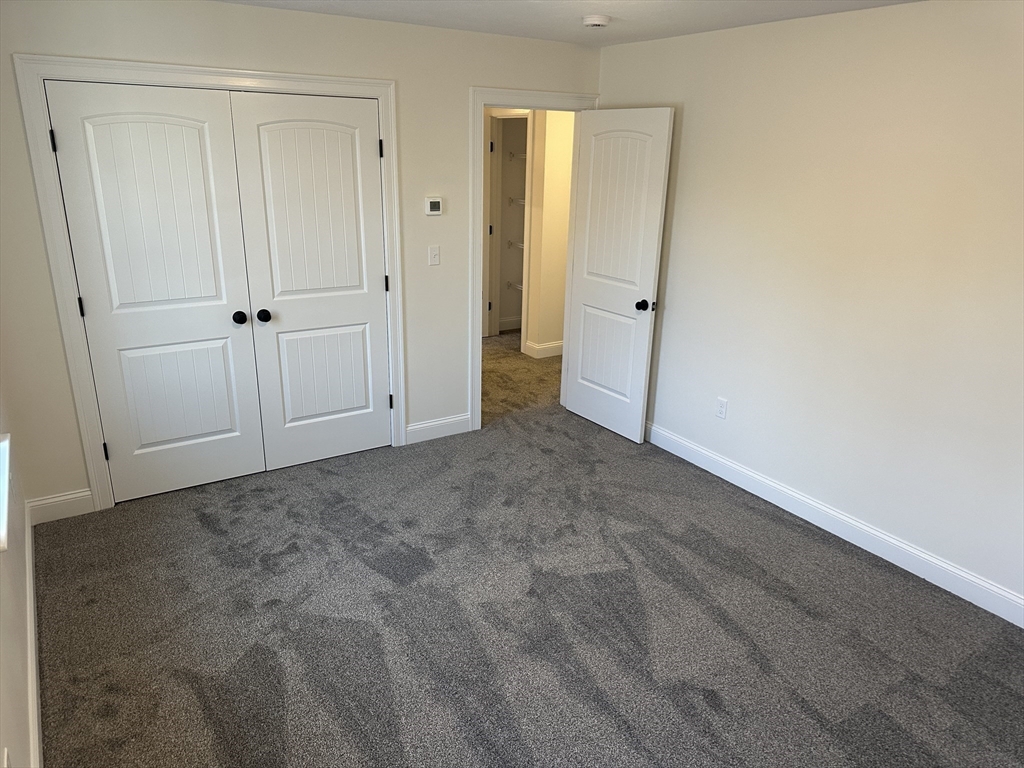 2 Hummingbird Path Watertown, MA 02472 - Photo 17 of 28 an empty room with closet area