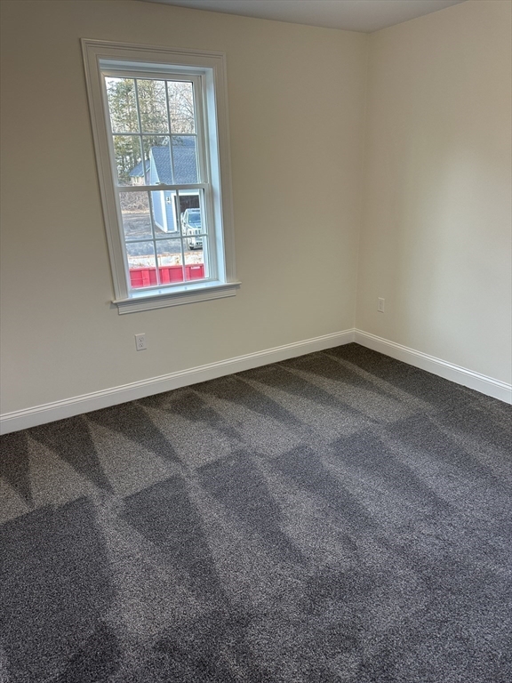 2 Hummingbird Path Watertown, MA 02472 - Photo 20 of 28 an empty room with a window