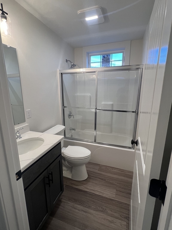 2 Hummingbird Path Watertown, MA 02472 - Photo 8 of 28 a bathroom with a toilet sink and shower