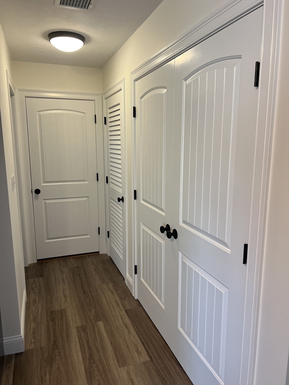 2 Hummingbird Path Watertown, MA 02472 - Photo 9 of 28 a view of a hallway with wooden floor